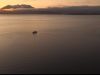 Alaska small cruise ship with sunset
